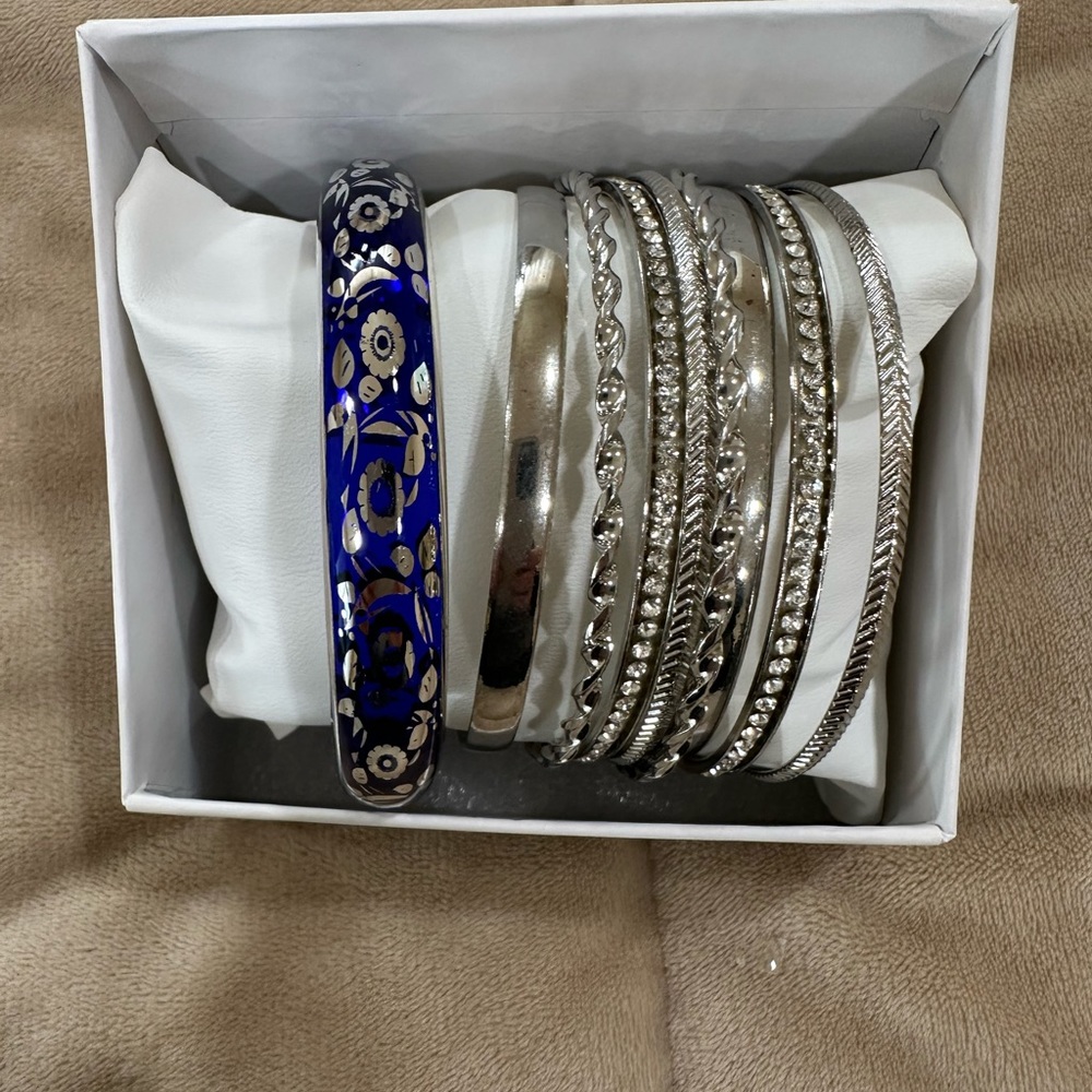 Women’s 8 silver and blue color bracelets.